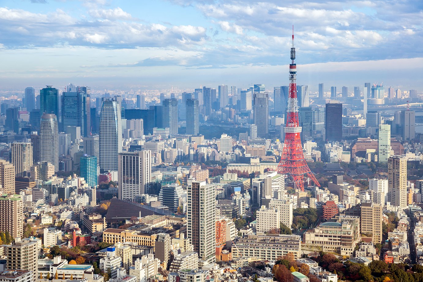 The fund makes its first real estate investments in Asia, acquiring 70 percent of five properties in Tokyo.
