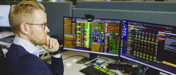 A man in a blue shirt is sitting at a desk with a computer monitor in front of him. He is using a keyboard and appears to be focused on the screen.
AI generated content