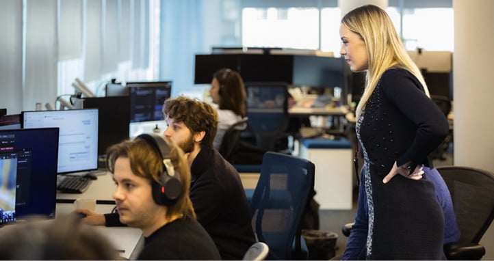 Colleagues working and reviewing data at the New York office.