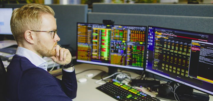 A man in a blue shirt is sitting at a desk with a computer monitor in front of him. He is using a keyboard and appears to be focused on the screen.

AI generated content