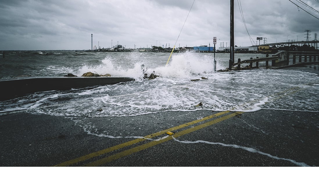 Waves crashing across the road